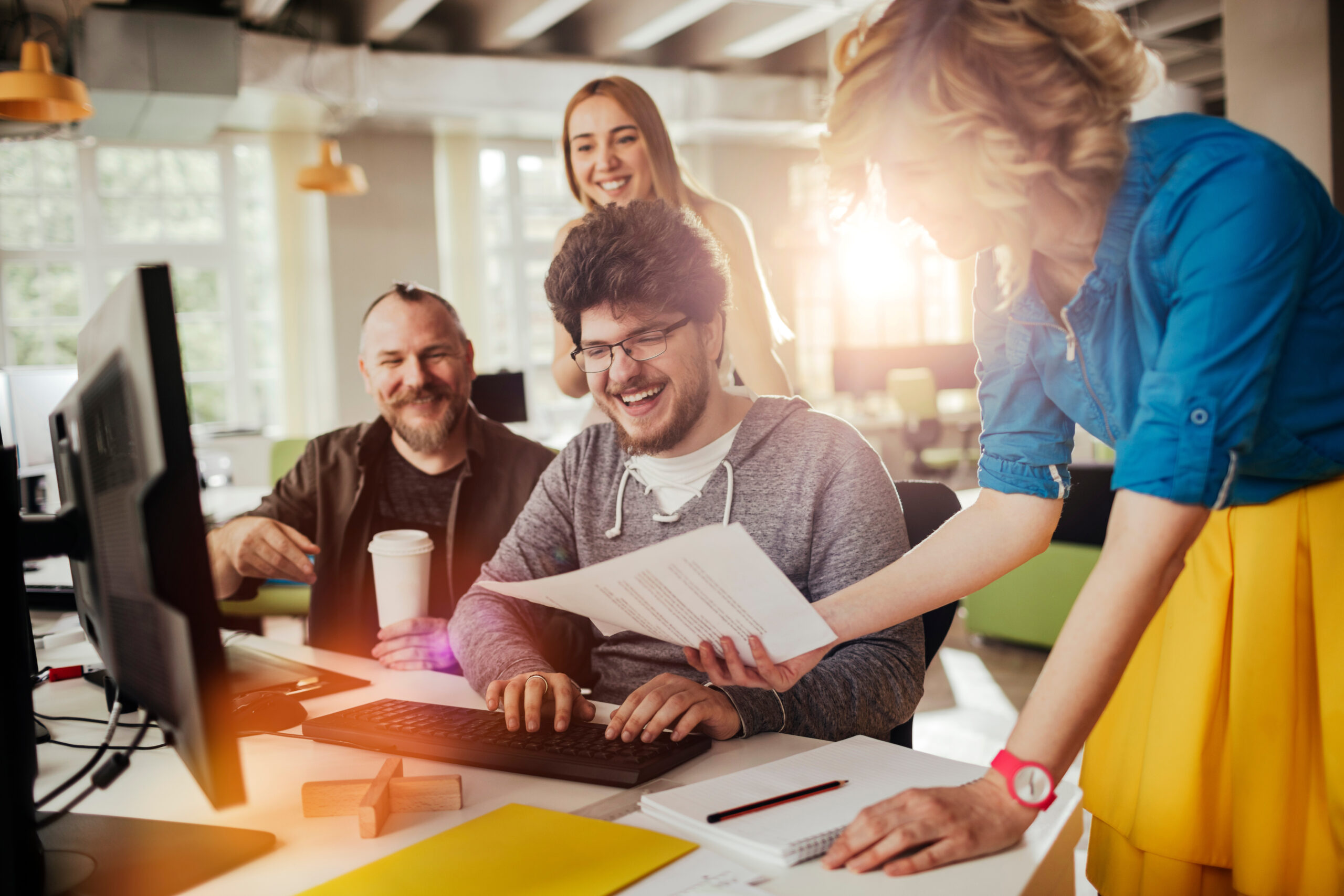 Diverse group of people working in a modern business office together